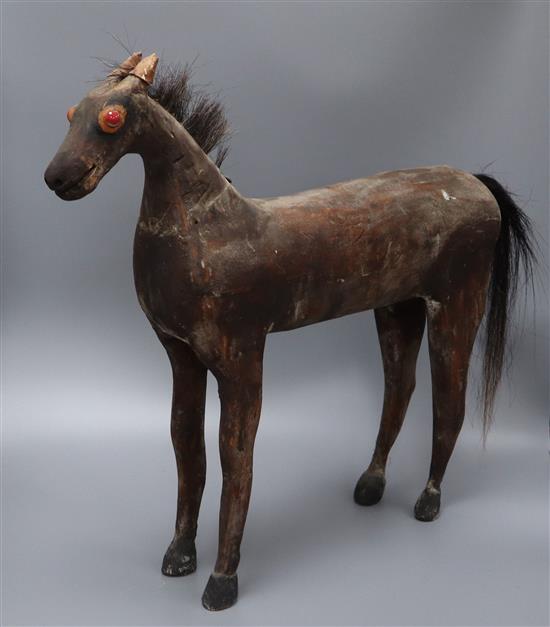 A carved wood horse height 53cm